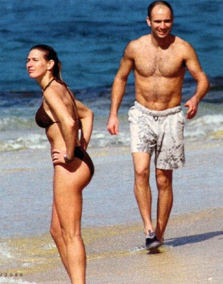 Steffi Graf in a dark brown bikini with Andre Agassi enjoying a day at the beach